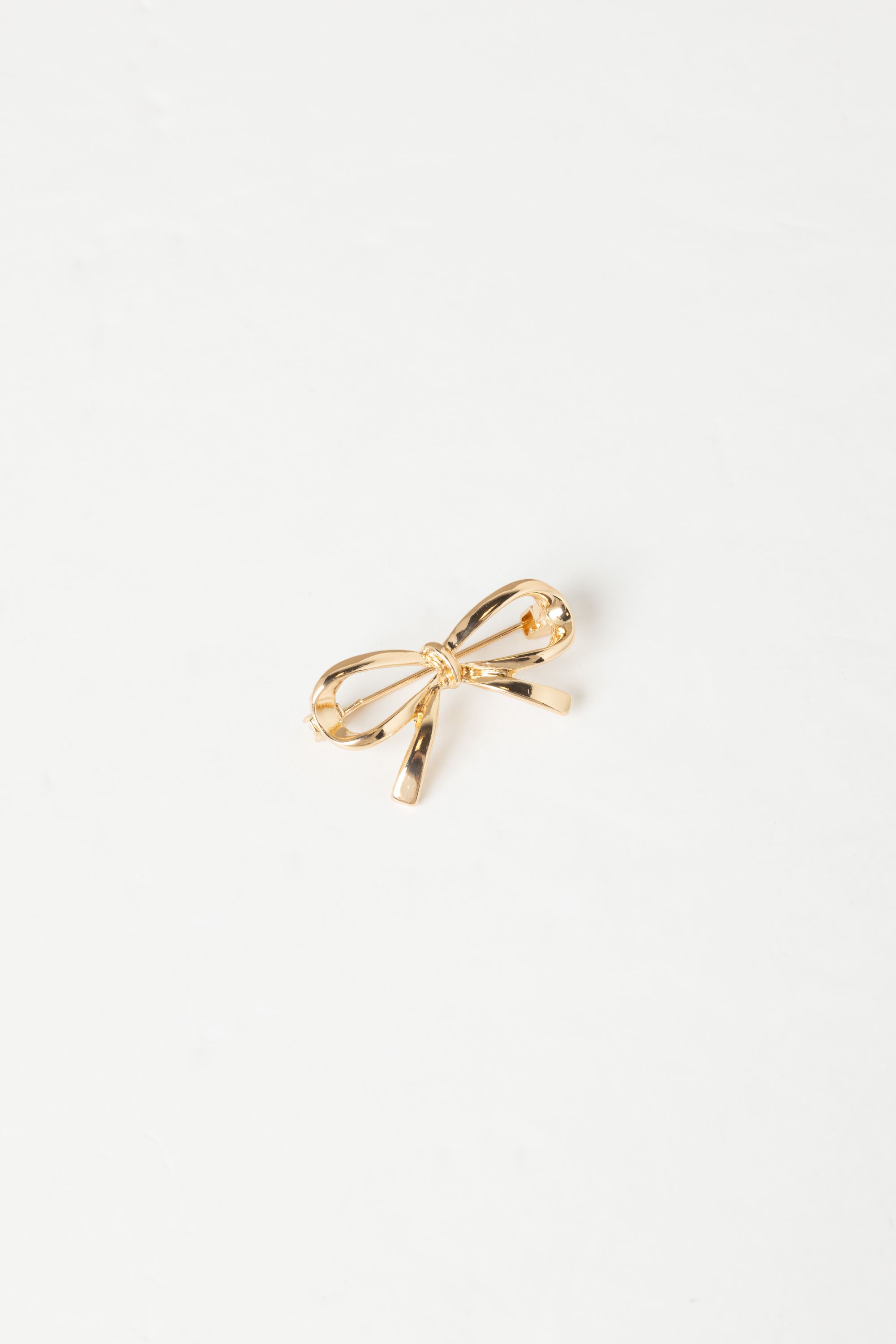 Broche goudkleurige strik 