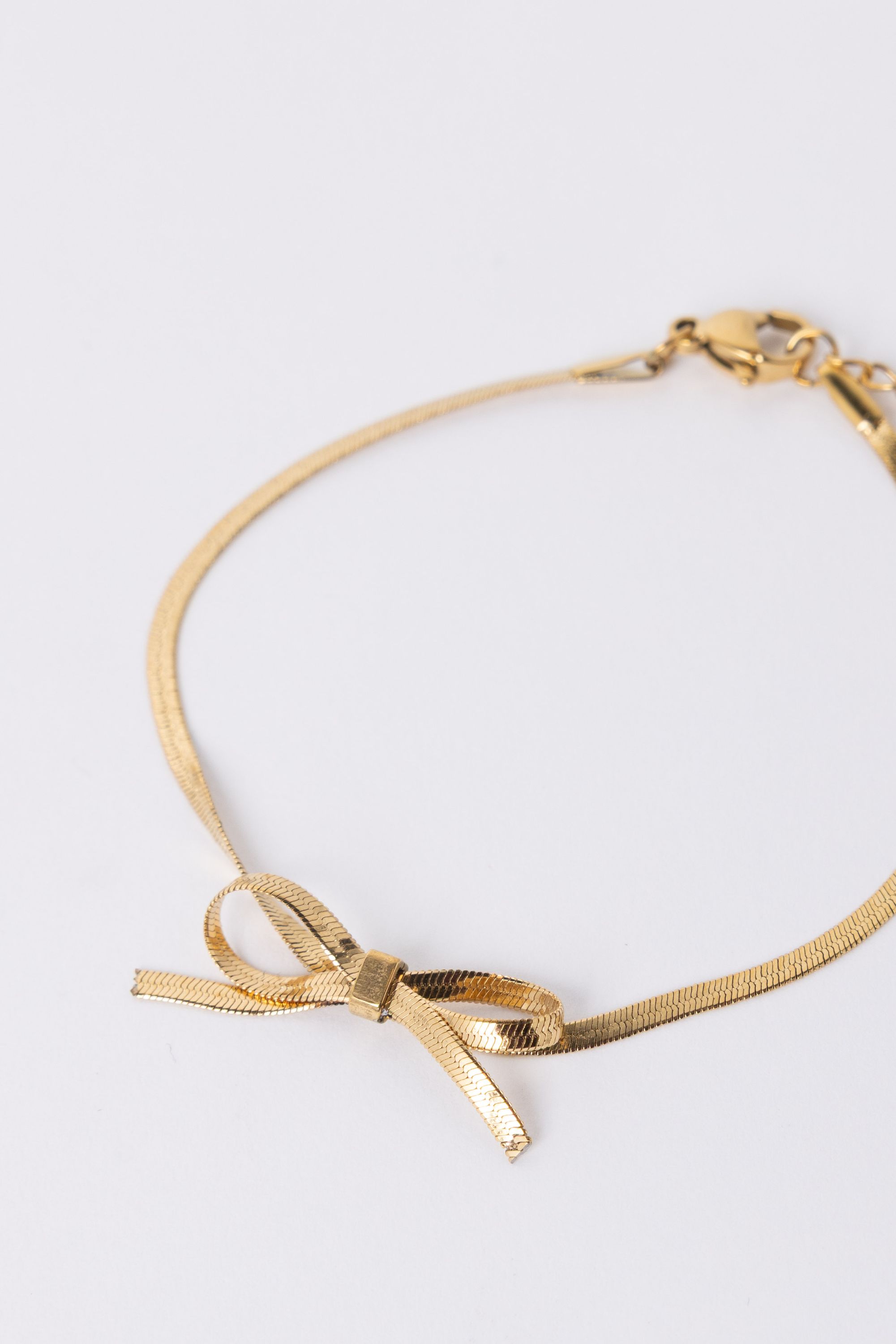 Norah Goudkleurige armband met strikje gold 218284-199-ONE